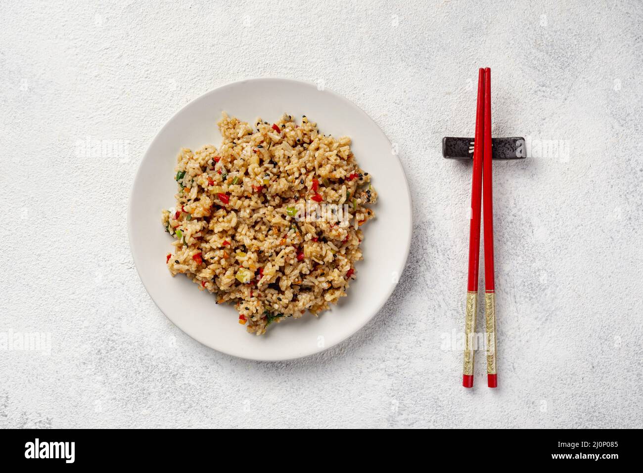 Top view rice with vegetables plate chopsticks. High quality and resolution beautiful photo concept Stock Photo