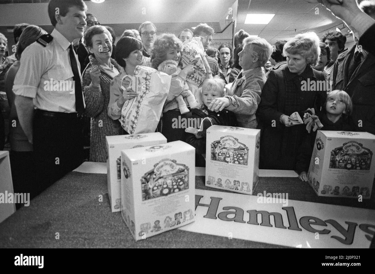 Shoppers buying Cabbage Patch Dolls at Hamleys, London toy store. 3rd