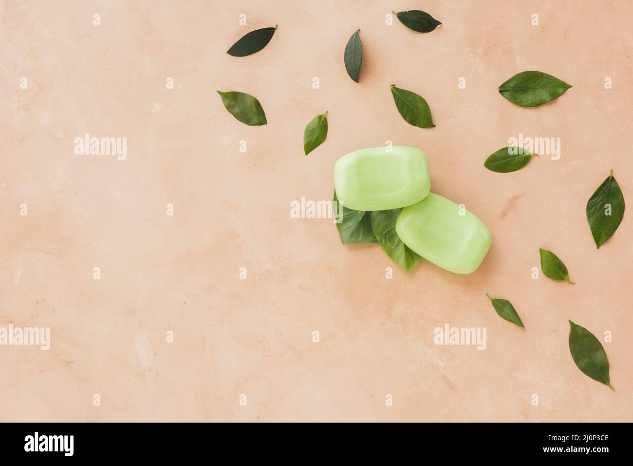 Soap bars leaves orange background with copy space. High quality and