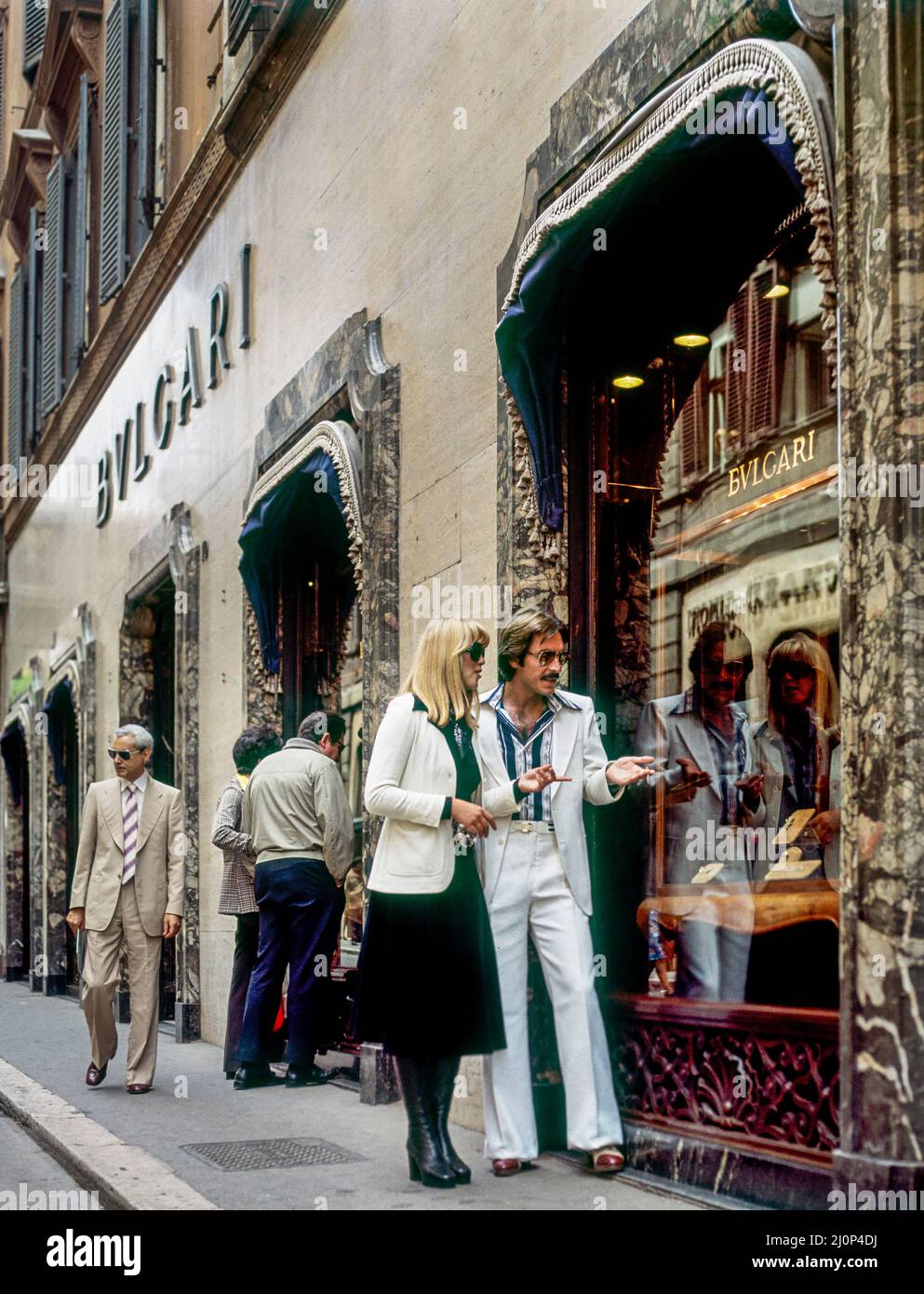 Vintage Rome 1970s, stylish couple shopping by Bulgari Bvlgari  jeweller, Via dei Condotti street, Italy, Europe, Stock Photo