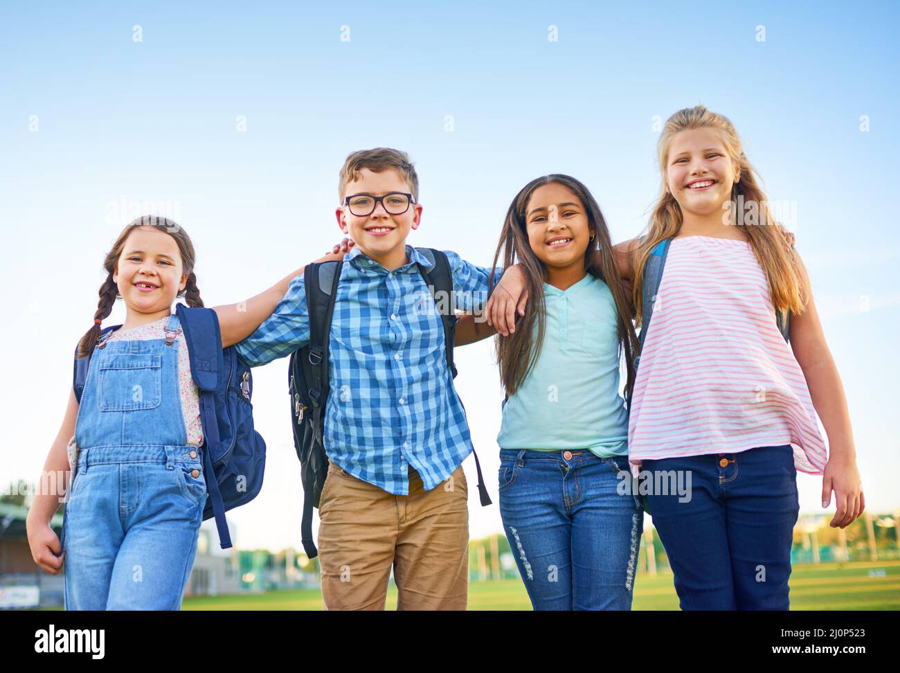 Friends make everything fun. Shot of a group of elementary school children together. Stock Photo