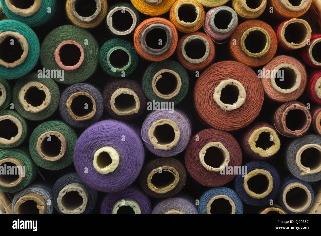 Top view colourful sewing threads background. High quality and resolution beautiful photo concept Stock Photo