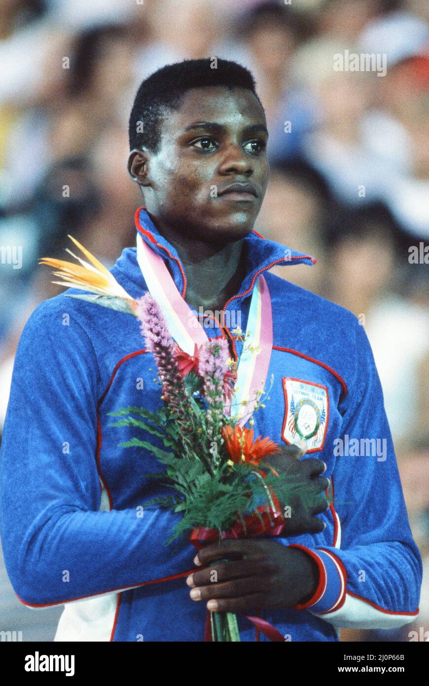 1984 Olympic Games in Los Angeles, USA. American athlete Carl Lewis, gold medal winner in the 100 metres, the long jump, the 200 metres and the 4 x 100 metres relay. Here he is pictured on the podium with silver medal winning compatriot Kirk Baptiste after the 200 Metres Final. August 1984. Stock Photo