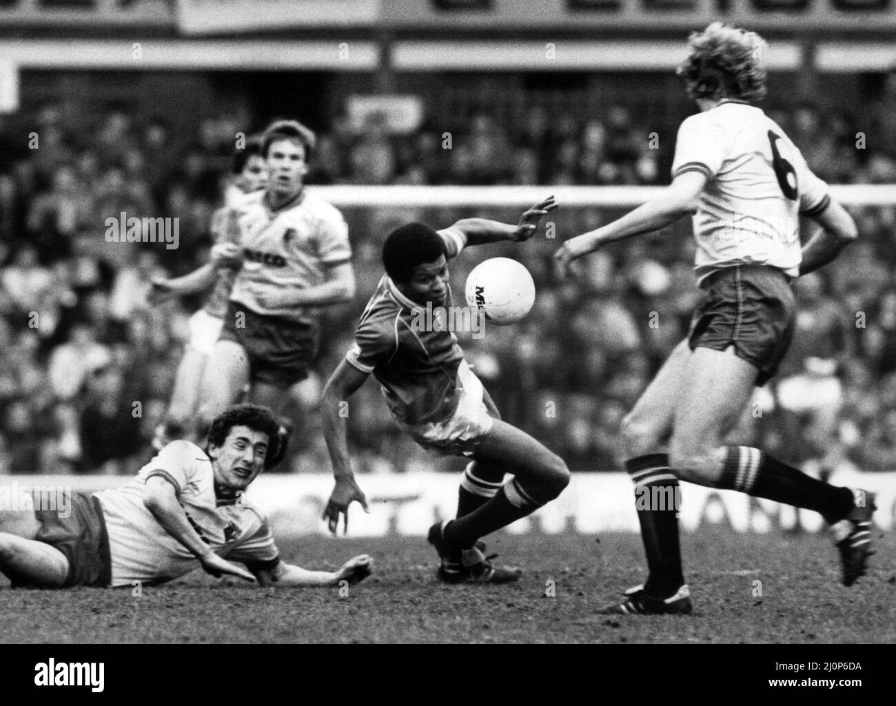 Birmingham City's Howard Gayle loses his way and takes a tumble watched by Rostron (left) and Franklin (right. Birmingham City v Watford, FA Cup Quarter-final, final score 3-1 to Watford. 10th March 1984. Stock Photo