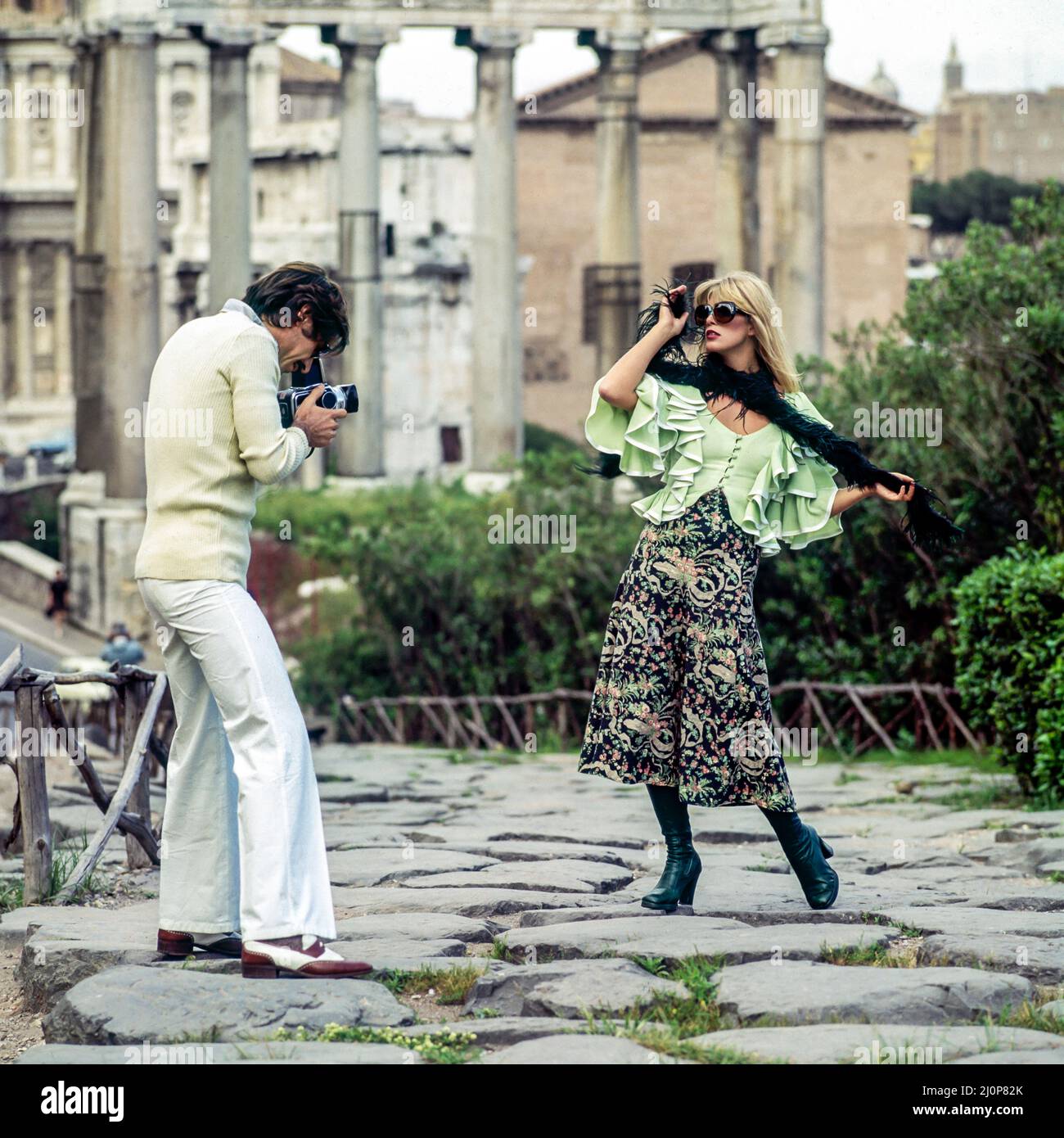 Vintage Rome 1970s, photographer shooting pictures with female fashion model, Foro Romano Forum Antico, Italy, Europe, Stock Photo