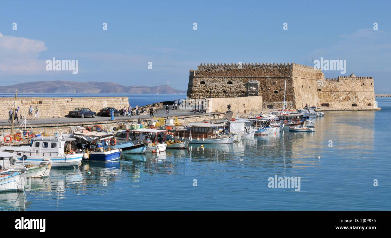 The fishing harbour and the castle at heraklion city in Crete island in Greece Stock Photo
