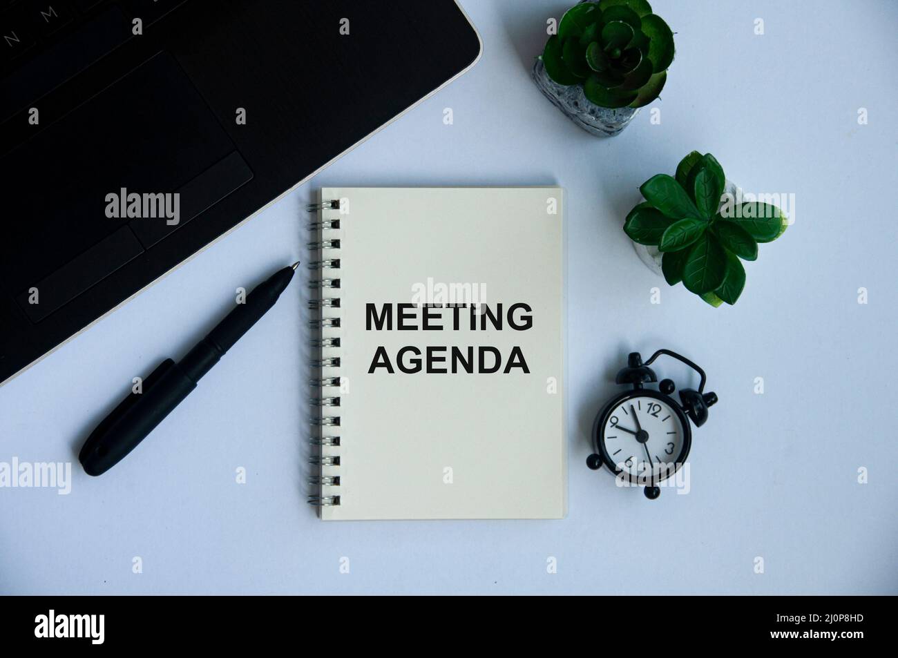 Meeting agenda text on notepad with office concept background. Business and office concept Stock Photo