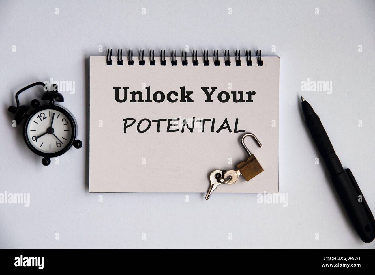Motivational quote notepad - Unlock your potential. Motivational and inspirational concept Stock Photo