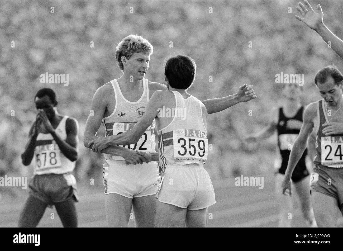 1984 Olympic Games in Los Angeles, USA. Mens Athletics. Great Britain's Sebastain Coe wins the 1500 metres gold medal congratulated by fellow Brit Steve Cram who took silver. 11th August 1984. Stock Photo