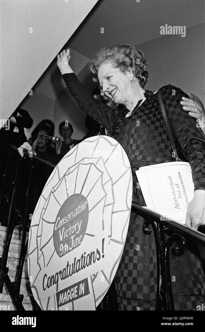 Prime Minister Margaret Thatcher celebrates at Conservative party headquarters after winning the General Election. Mr. Thatcher holds large button that reads, 'Conservative Victory, 9th June. Congratulations, Maggie in.'10th June 1983 Stock Photo