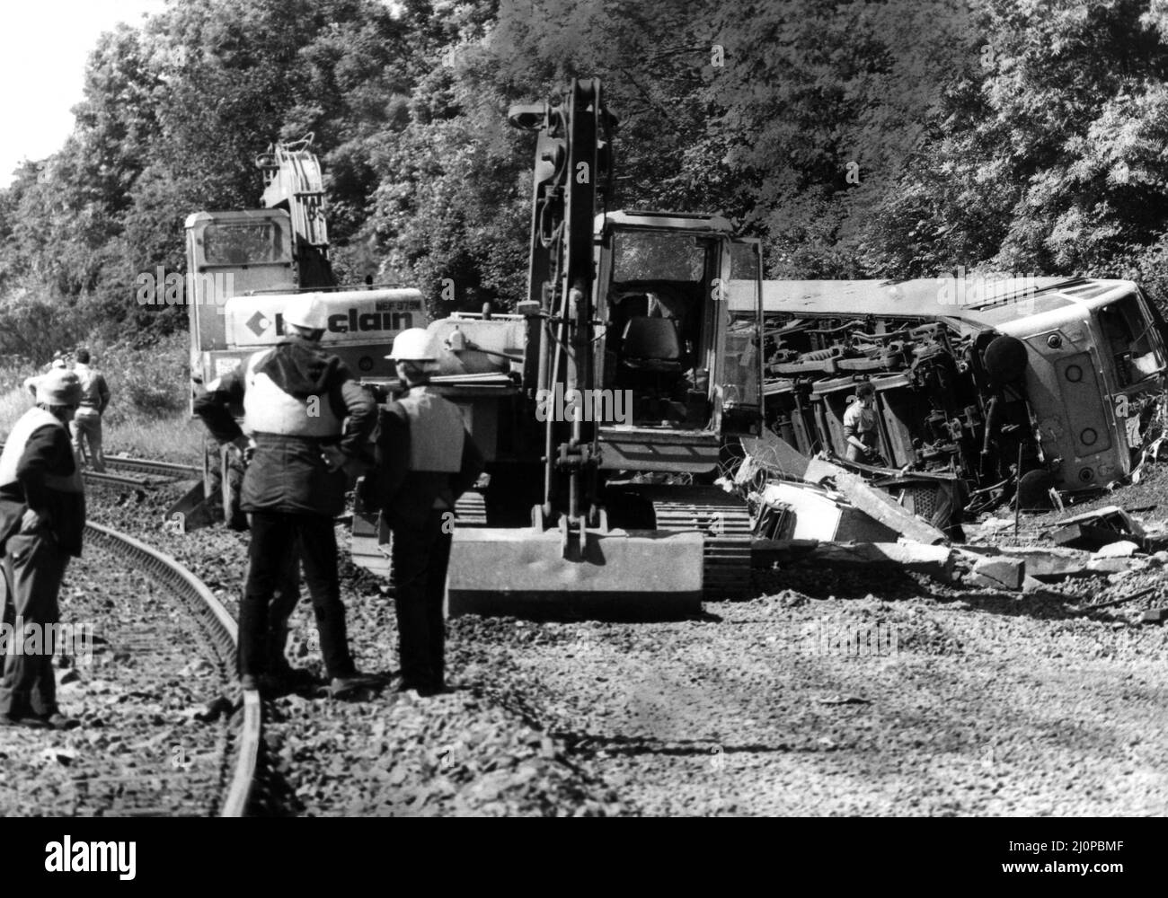 The crash of the Aberdeen to London sleeper train which careered off the track on the notorius Morpeth curve, just half a mile from the station. The crash happened at 10 minutes past midnight on 24th June, 1984   The engine is still on it's side as work goes on the clear the track Stock Photo