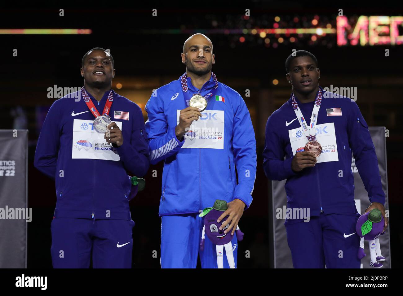 Belgrade, Serbia. 20th Mar, 2022. Gold medalist Lamont Marcell Jacobs (C) of Italy, silver medalist Christian Coleman (L) and bronze medalist Marvin Bracy of the United States pose for photos during the awarding ceremony for men's 60m hurdles of the World Athletics Indoor Championships Belgrade 2022 in Stark Arena, Belgrade, Serbia, March 20, 2022. Credit: Zheng Huansong/Xinhua/Alamy Live News Stock Photo