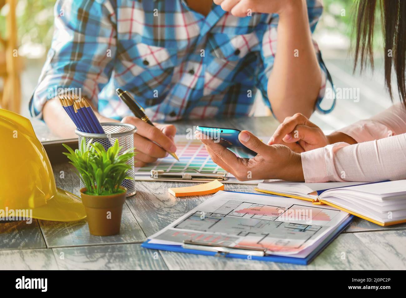 Builders and engineers, homeowners brainstorm choose the color to for design home office Stock Photo