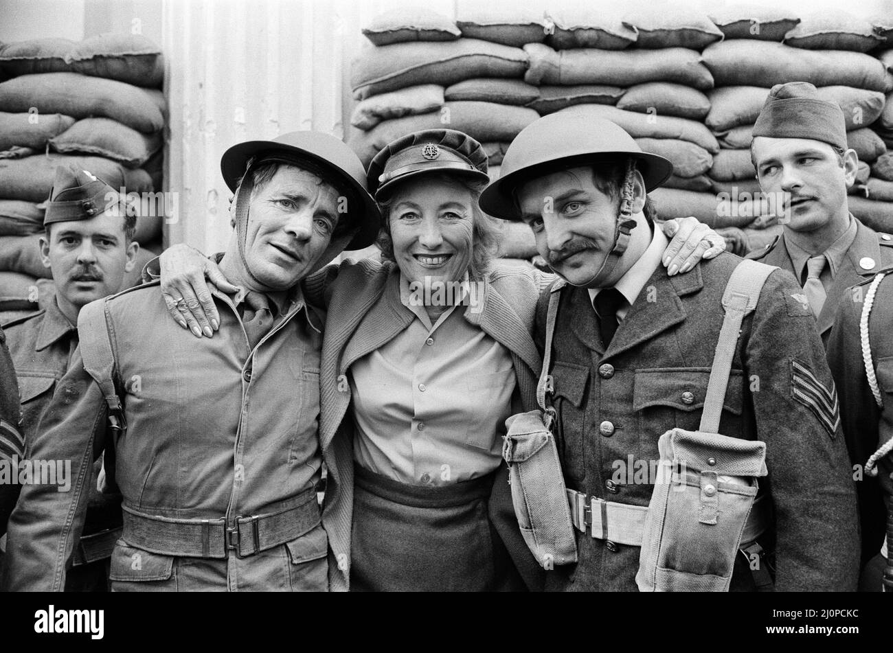 Dame Vera Lynn will appear at the Lyceum in 'Stage Door Canteen' to celebrate the 40th Anniversary of D Day. The front is sandbagged and Vera was wearing World War Two uniform for the photocall, she is pictured with some of the troops outside the theatre. 3rd June 1984. Stock Photo