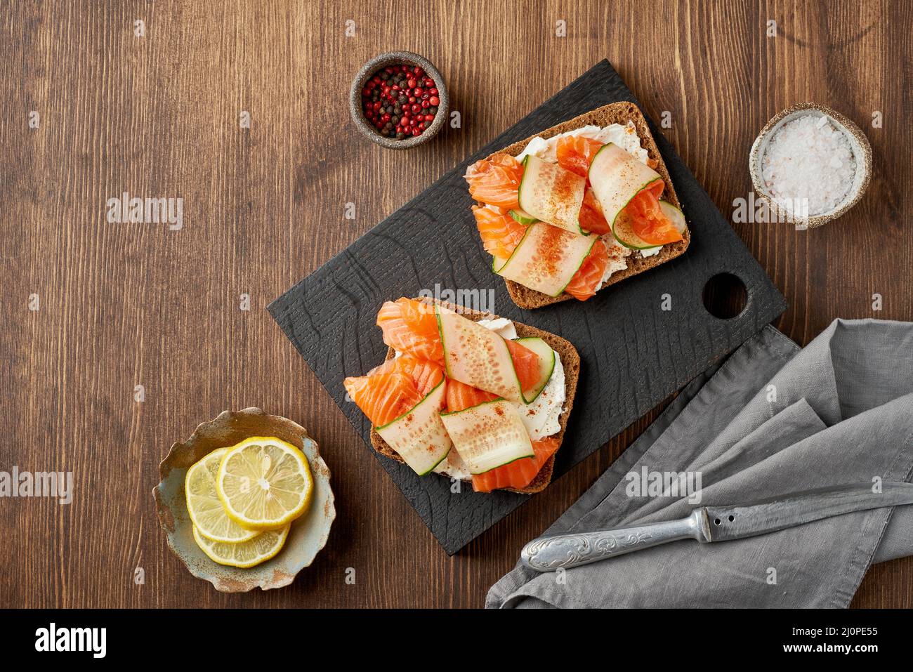 Smorrebrod - traditional Danish sandwiches. Black rye bread with salmon ...
