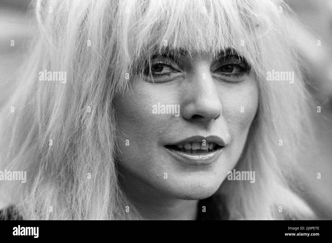 Debbie Harry pictured in London promoting her film Videodrome.  At this point, Blondie were not active as a band since the early 1982.  Though they did release new material in 1999.  Deborah Ann Harry (born Angela Trimble -  July 1, 1945) is an American singer, songwriter and actress, known as the lead vocalist of the band Blondie. Her recordings with the band reached No.?1 in the US and UK charts on many occasions from 1979 to 2017.  Blondie hits include Denis, Call Me, Hanging On The Telephone, Heart of Glass, Sunday Girl, Rapture and Atomic amongst many others.  Picture taken 21st November Stock Photo