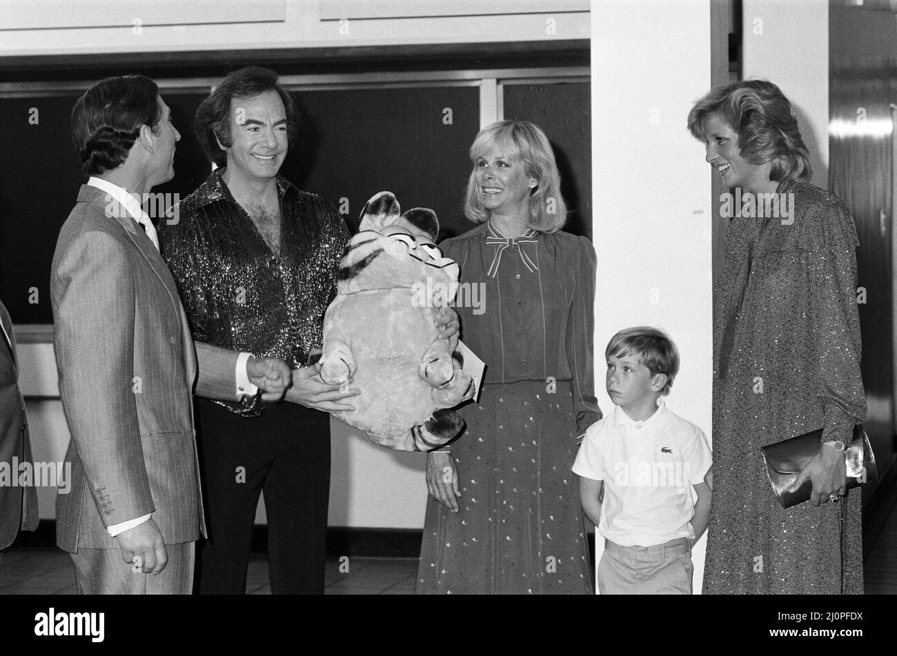 The Prince and Princess of Wales at Neil Diamond's concert at the National  Exhibition Centre, Birmingham. The Princess, nearly 7 months pregnant, is  pictured chatting to the singer. The cuddly Garfield toy