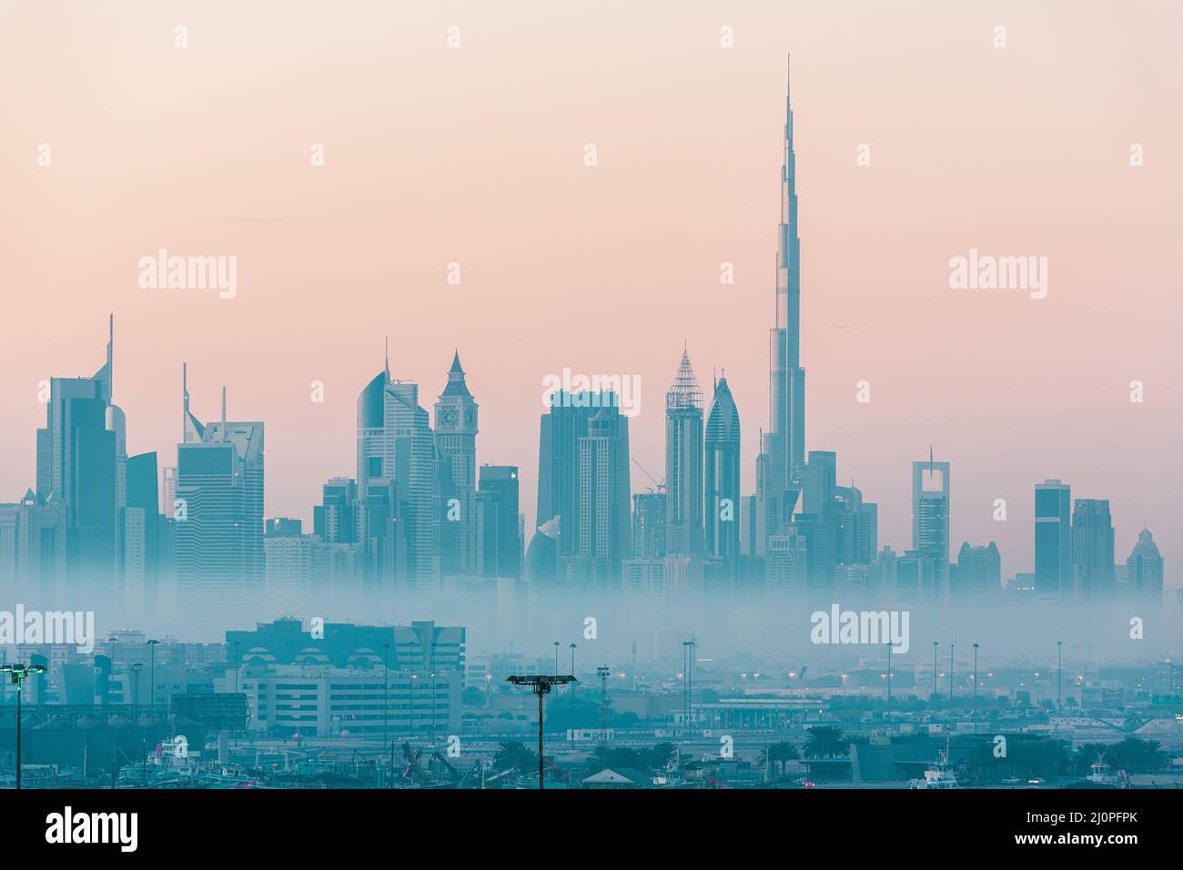 Dubai city skyline at morning fog Stock Photo