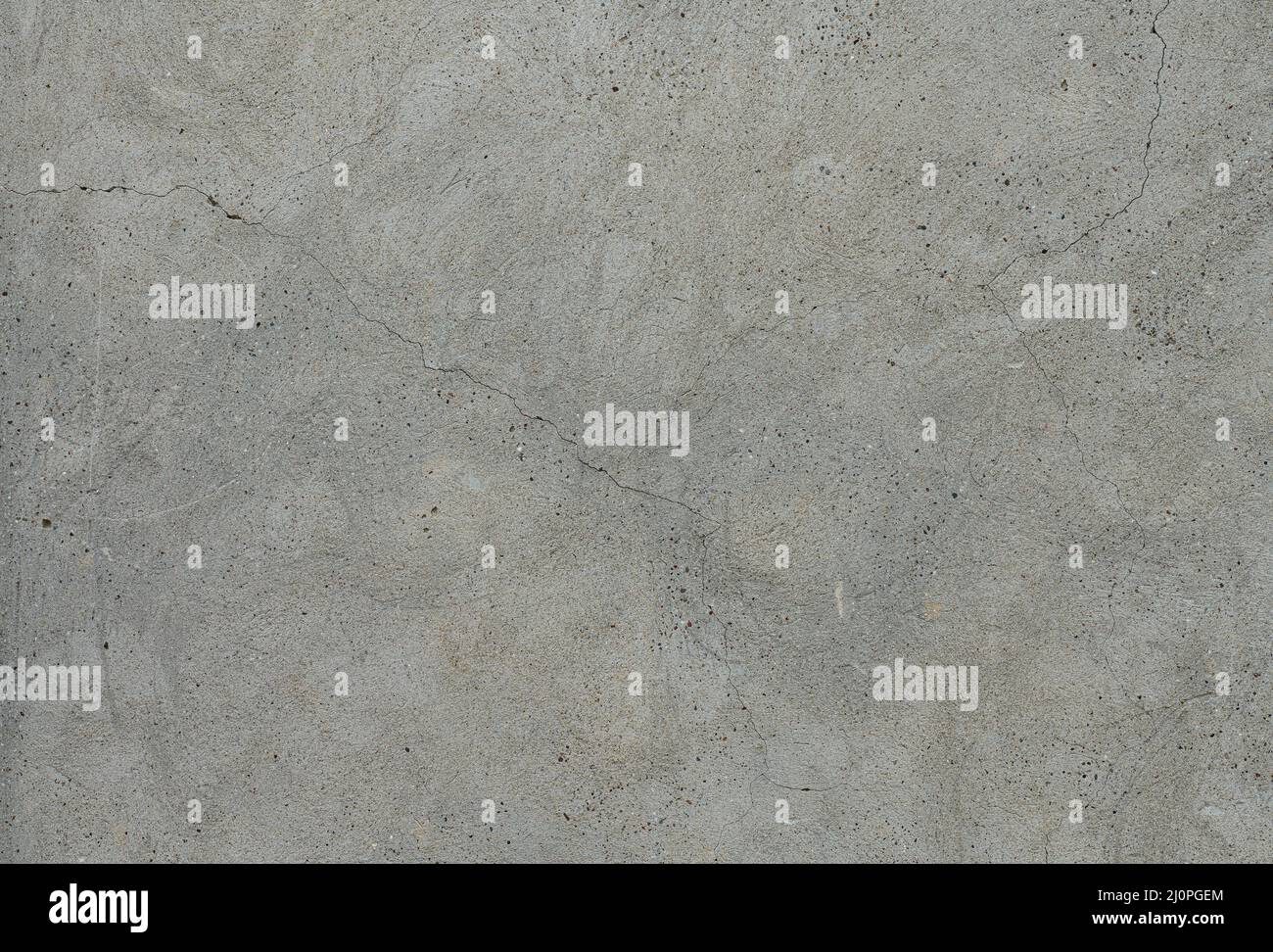 Grey concrete background. Cement wall with cracks. Stock Photo