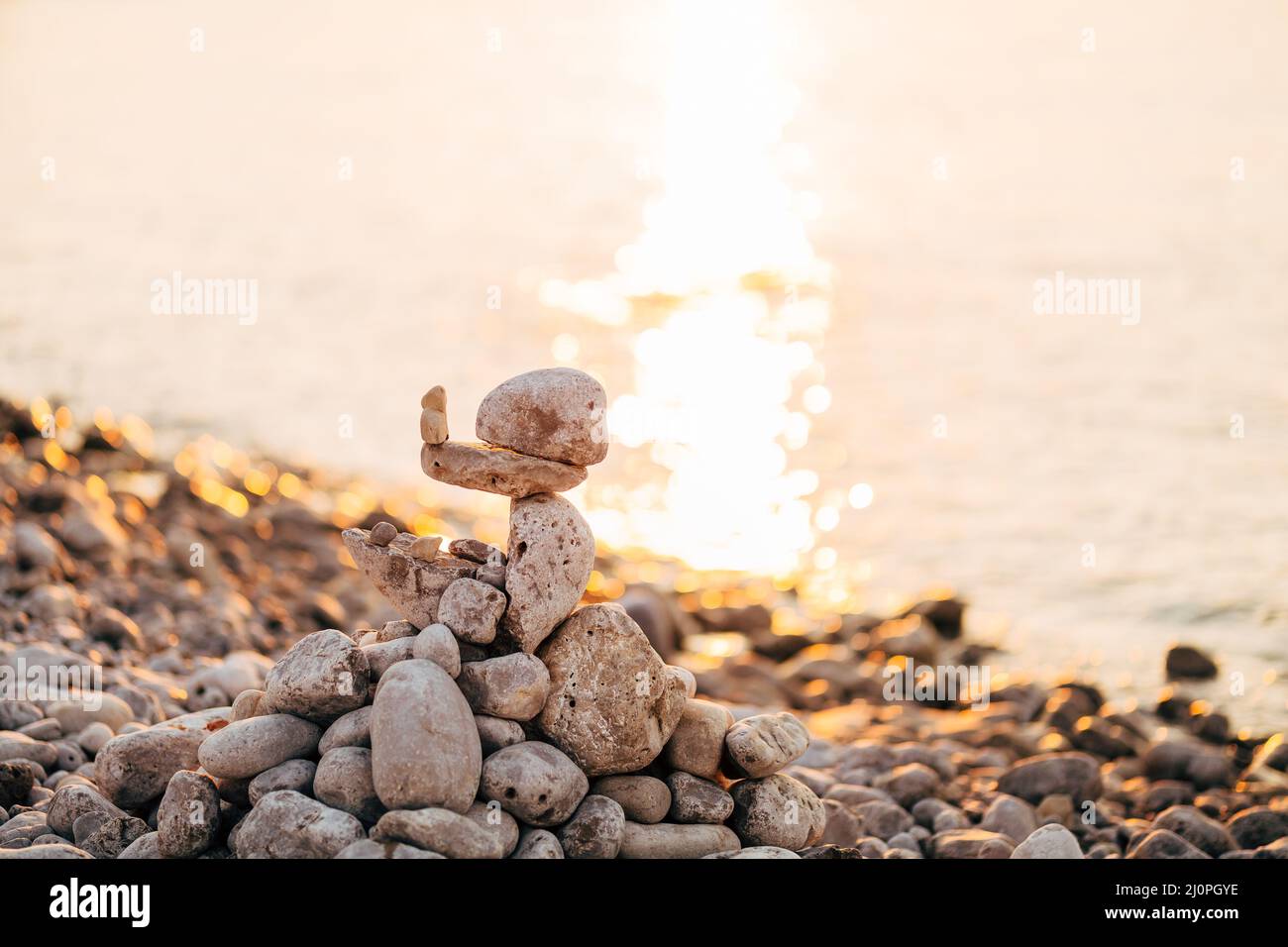 Stones stacked on top of each other by the sea Stock Photo