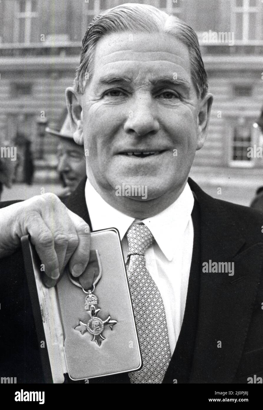 J.B.G Thomas (Bryn) former Western Mail Sports Editor - pictured March 1984 after receiving his M.B.E. . Stock Photo