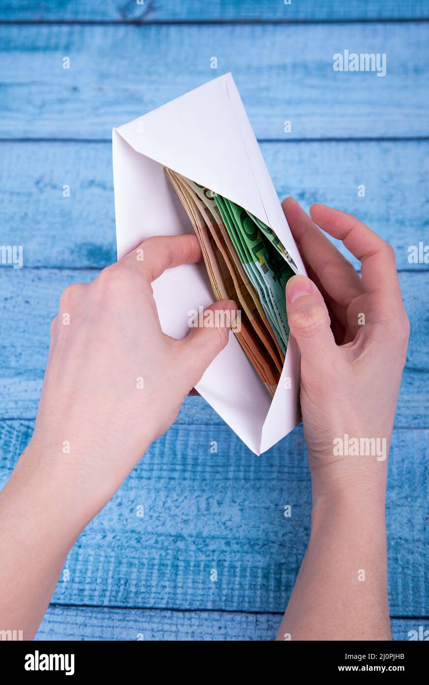Woman hands holding envelope hires stock photography and images Alamy
