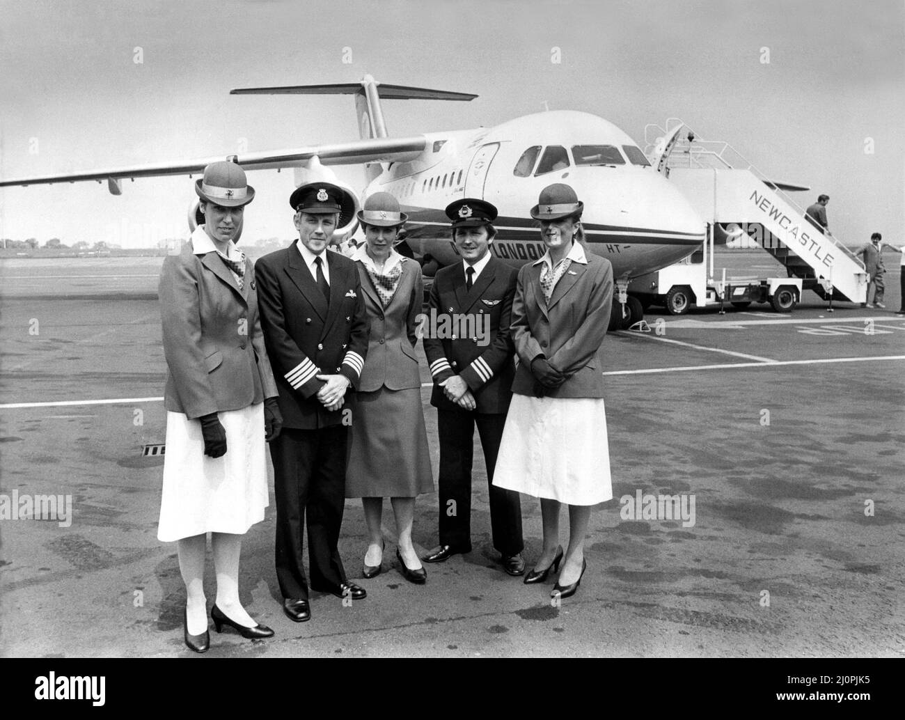 The new Dan-Air British Aerospace 146 (BAe 146), a medium-sized commercial airliner/aircraft also known as the 'Whisper Jet'. The plane flew officials and press into Newcastle Airport to publicise the new 7m jet and service.   The crew, left to right, are stewardess Joyce Pearcey, Capt. John Nightingale, stewardess Frances Shepherd, senior first officer Owen Wright and stewardess Gail Gillies.    12/06/1983 Stock Photo