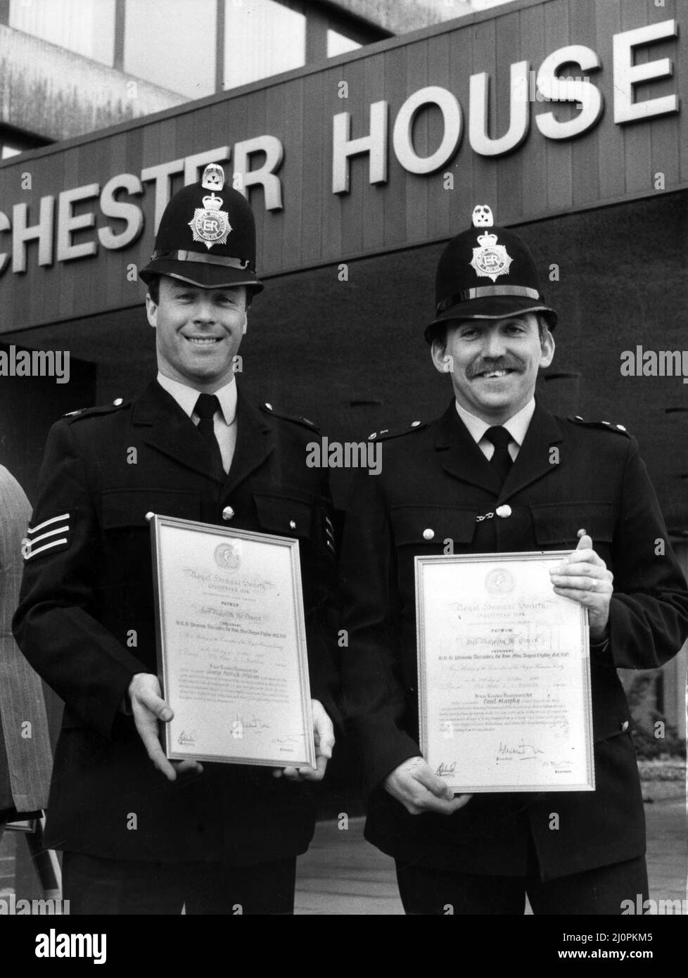 Two Manchester policemen stoned by rioting pickets as they fought to save a miner's life have earned a top award. Dramatic pictures of Sgt George Watson (left) and Pc Paul Murphy made front page news last June at the height of the Mineworkers' Union Dispute, as they helped one man who was injured outside the Orgreave coking plant in South Yorkshire. 17th May 1984. Stock Photo