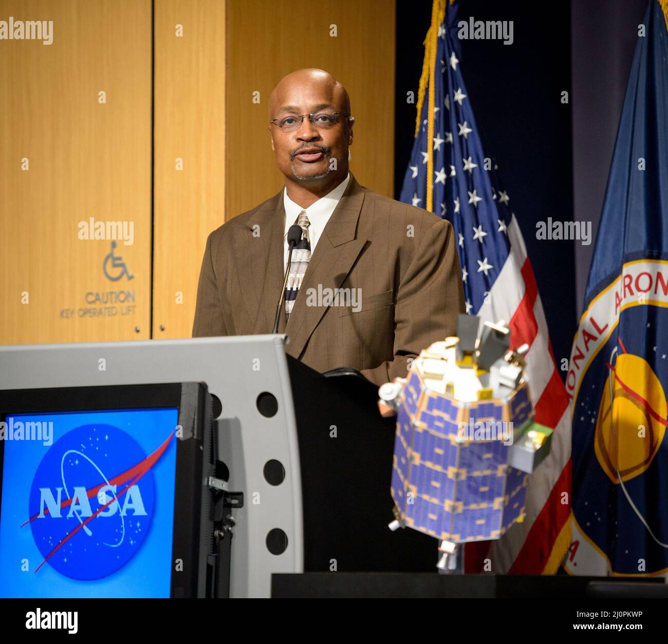 NASA Headquarters Public Affairs Officer Dwayne Brown moderates a Lunar Atmosphere and Dust Environment Explorer (LADEE) mission briefing at NASA Headquarters, Thursday, August 22, 2013 in Washington. Data from NASA's LADEE mission will provide unprecedented information about the environment around the moon and give scientists a better understanding of other planetary bodies in our solar system and beyond. The LADEE mission is scheduled to launch at 11:27 p.m. Friday, Sept. 6, from NASA's Wallops Flight Facility on Wallops Island, Va.  Photo Credit: (NASA/Bill Ingalls) Stock Photo