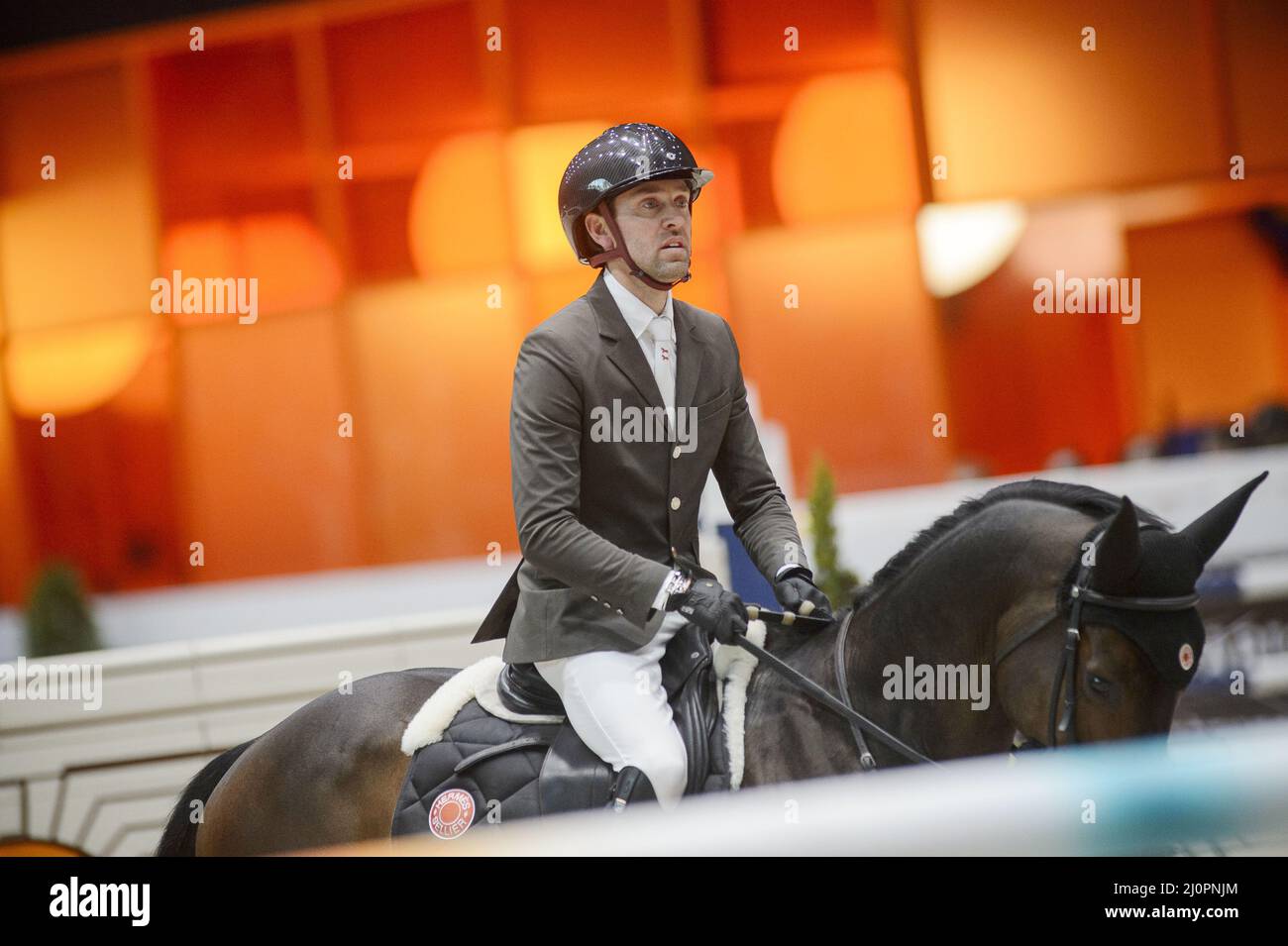 Simon DELESTRE (FRA) riding CAYMAN JOLLY JUMPER during the Saut Hermes prize at the Saut-Hermes 2022, equestrian FEI event on March 19, 2022 at the ephemeral Grand-palais in Paris, France - Photo: Christophe Bricot/DPPI/LiveMedia Stock Photo