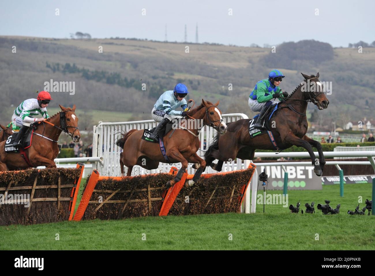 Day 1 of the Cheltenham Festival at Cheltenham Racecourse.    Champion Hurdle    Appreciate It ridden by Paul Townend leads on the first circuit Stock Photo