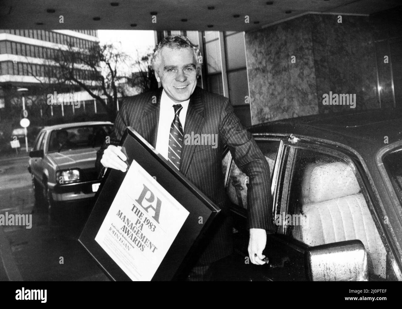 Mr John Egan, chairman of Jaguar Cars, leaves Birmingham Chamber of Industry and Commerce after being presented with the 1983 PA Management awards for individual achievement. 1st February 1984. Stock Photo