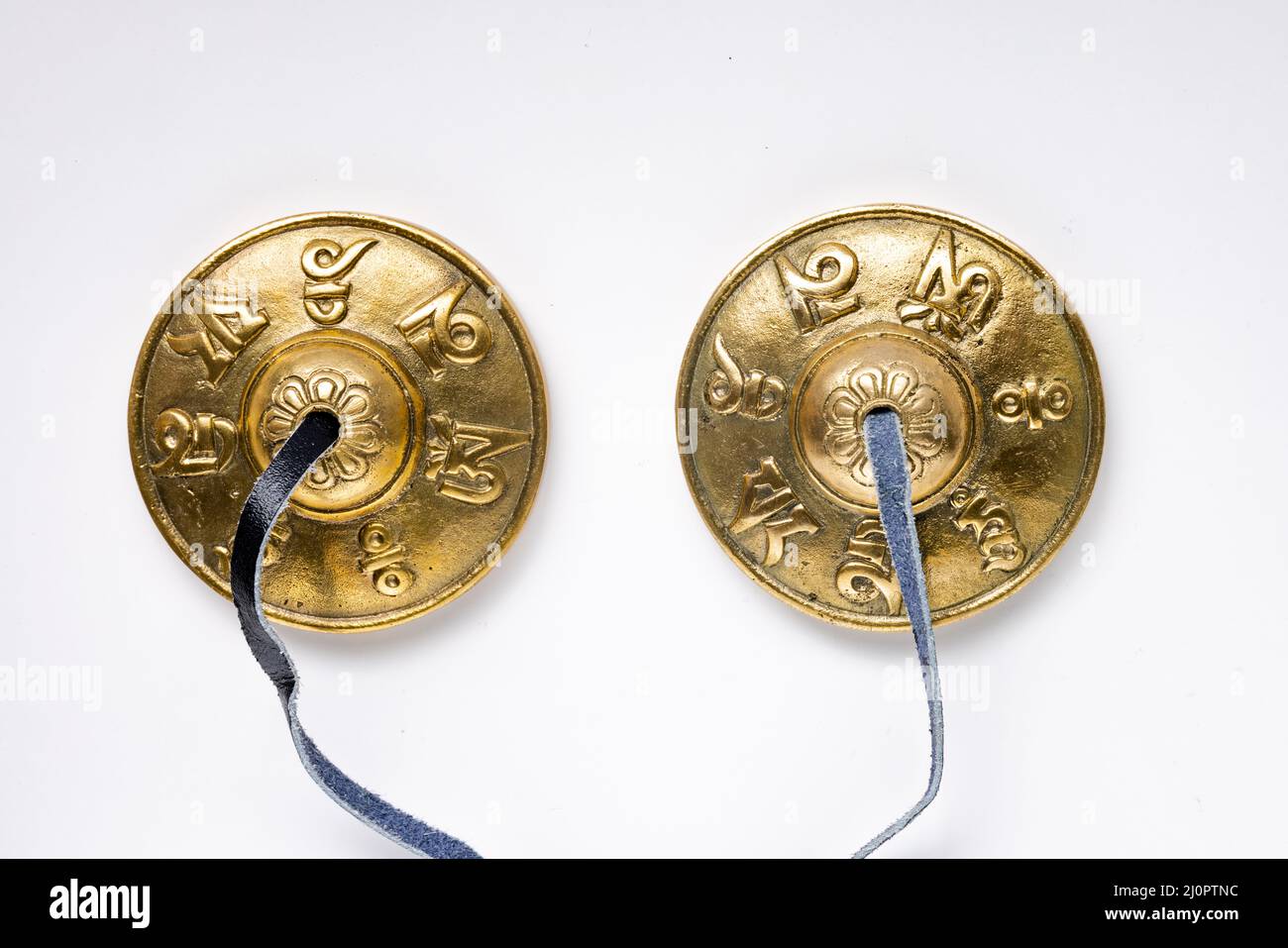 Tibetan Tingsha Cymbals, Mane Padme Hum Symbols Embossed Hand Tuned from Nepal Stock Photo