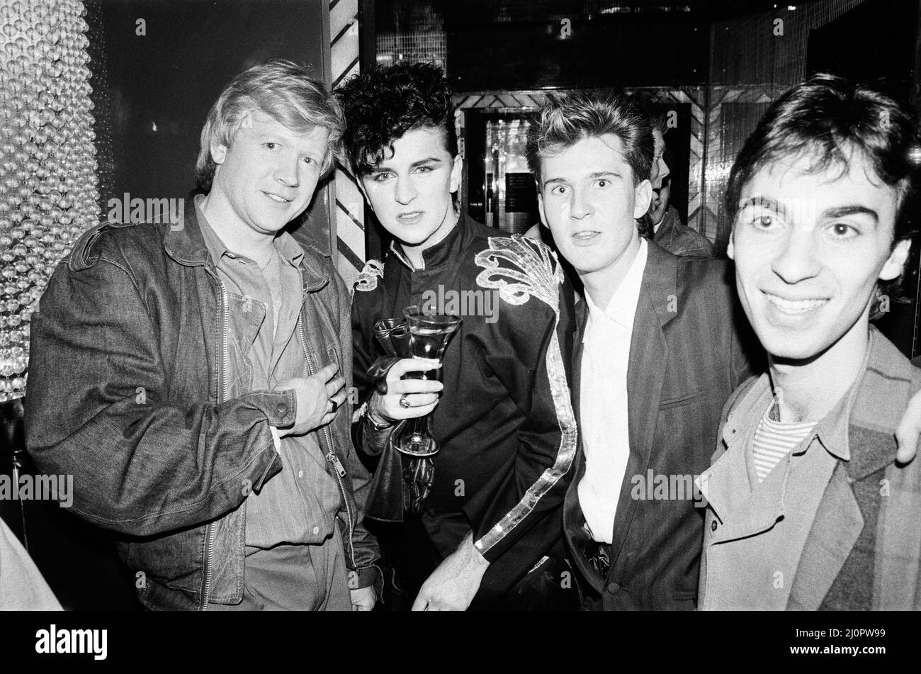 Top of the Pops 1000th programme party. Pictured, David ¿¿ensen¿left), Steve Strange (second from left) and other guests at the party at The Gardens night club in Kensington, London. 5th May 1983. Stock Photo