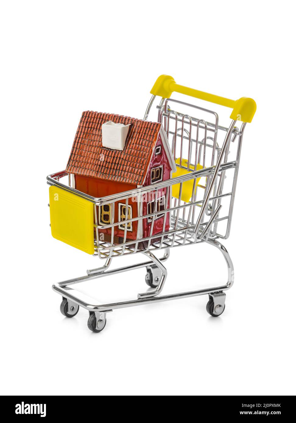 Toy house in shopping cart Stock Photo