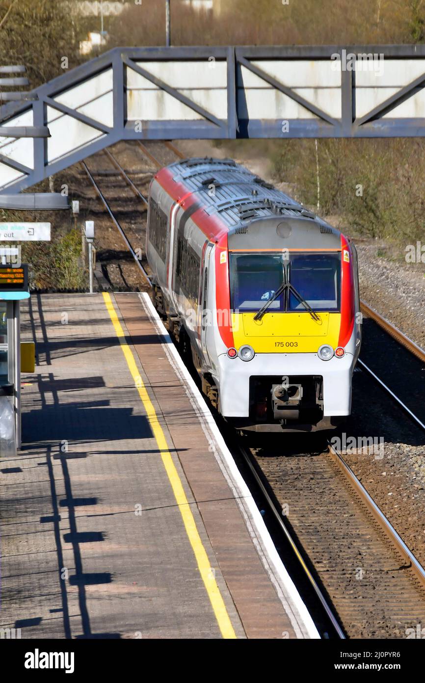 Pontyclun, Wales - March 2022:  Diesel passenger train operated by Transport for Wales leaving the the railway station in the village of Pontyclun Stock Photo