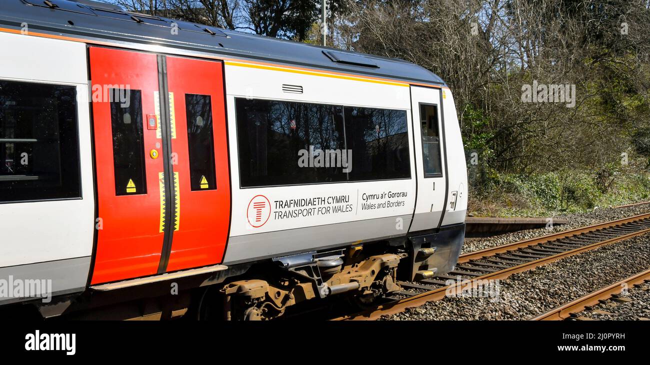 Pontyclun, Wales - March 2022:  Side view of a passenger train operated by Transport for Wales at the railway station in the village of Pontyclun Stock Photo