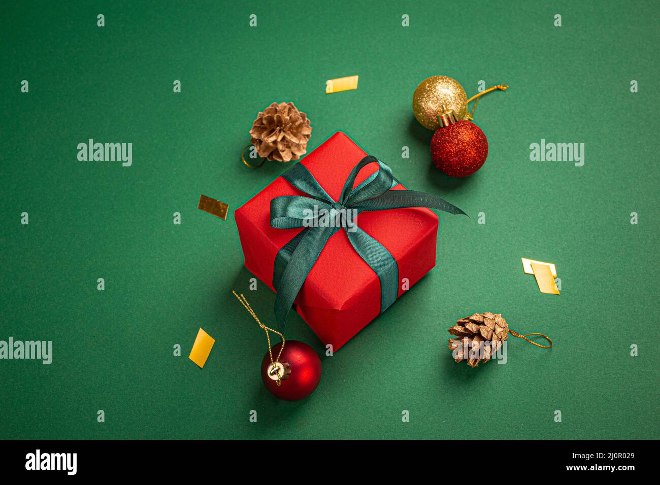 Christmas composition with present and decorations in red, green, golden colors Stock Photo