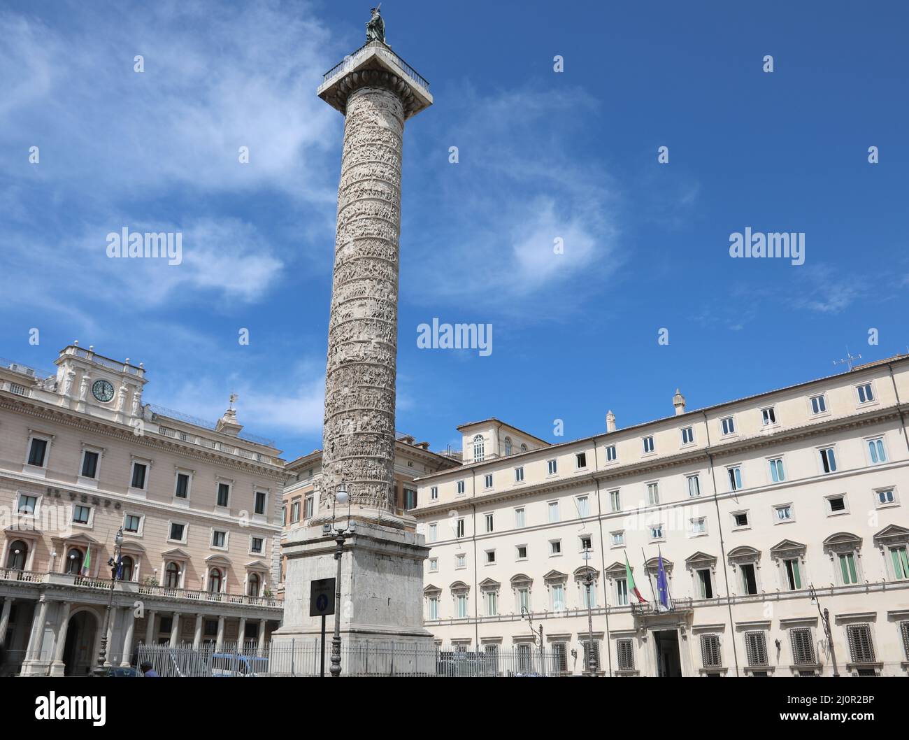 Rome, RM, Italy - August 18, 2020:  Ancient Roman column and In the background the building called Palazzo Chigi seat of the Italian government Stock Photo