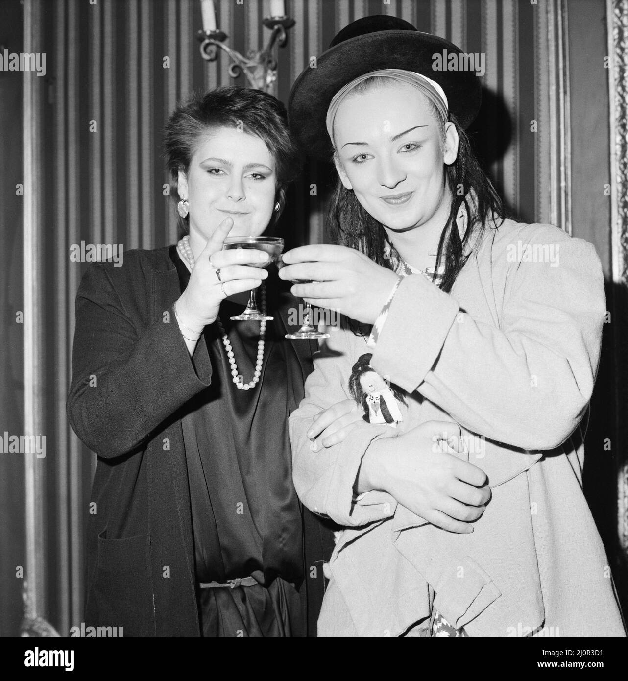 Alison Moyet, (also known as Alf from Yazoo. Pictured left) wins the Best Female Singer and Boy George, from the pop group Culture Club (pictured right), won The Daily Mirror Readers Award, at The British Rock and Pop Awards held at The Lyceum Ballroom in London. Both pictured enjoying the night.  Picture taken 8th February 1983 Stock Photo