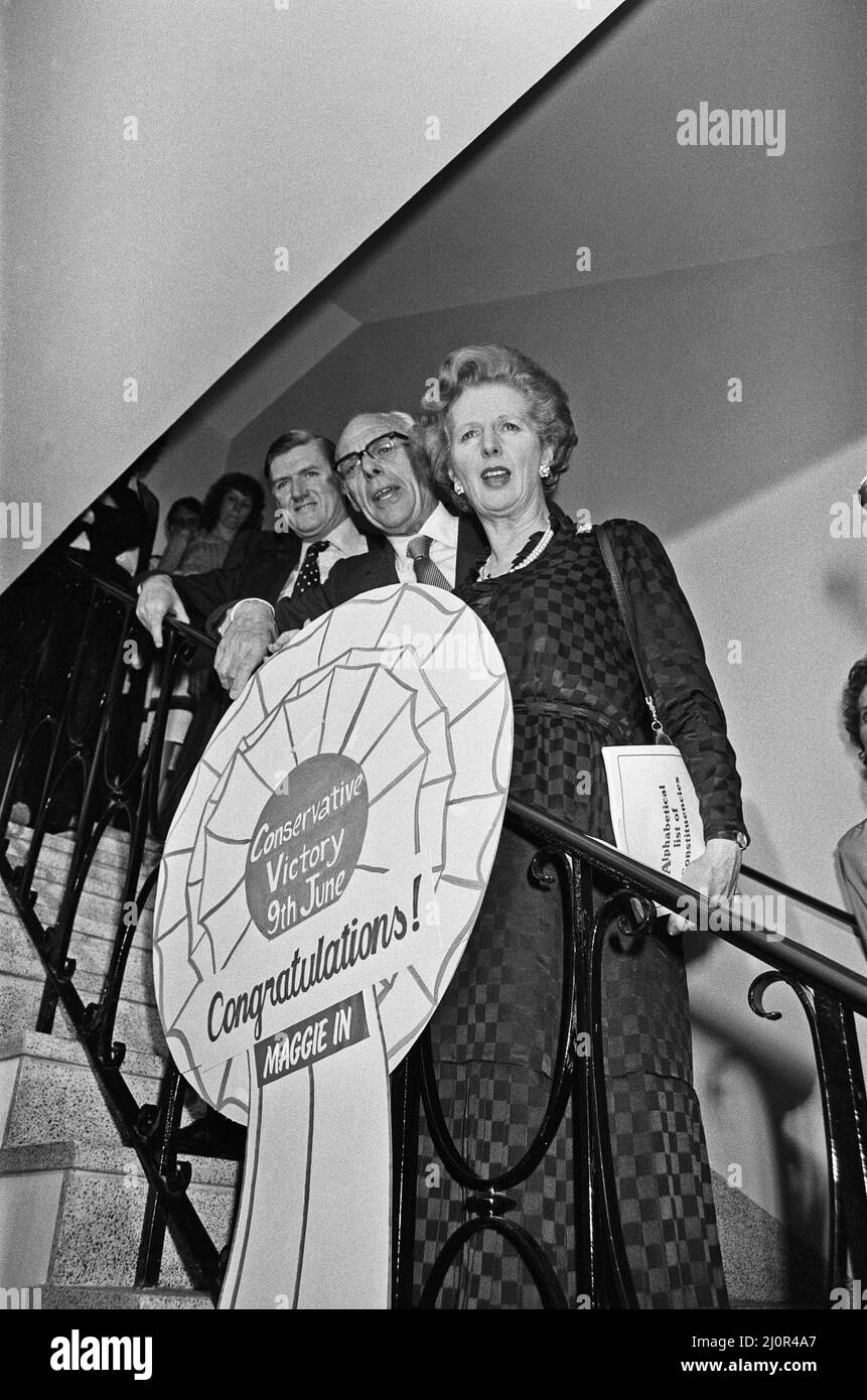Prime Minister Margaret Thatcher, with husband Denis and Conservative Party Chairman Cecil Parkinson celebrate at party headquarters after winning the General Election. Mr. Thatcher holds large button that reads, 'Conservative Victory, 9th June. Congratulations, Maggie in.'10th June 1983 Stock Photo