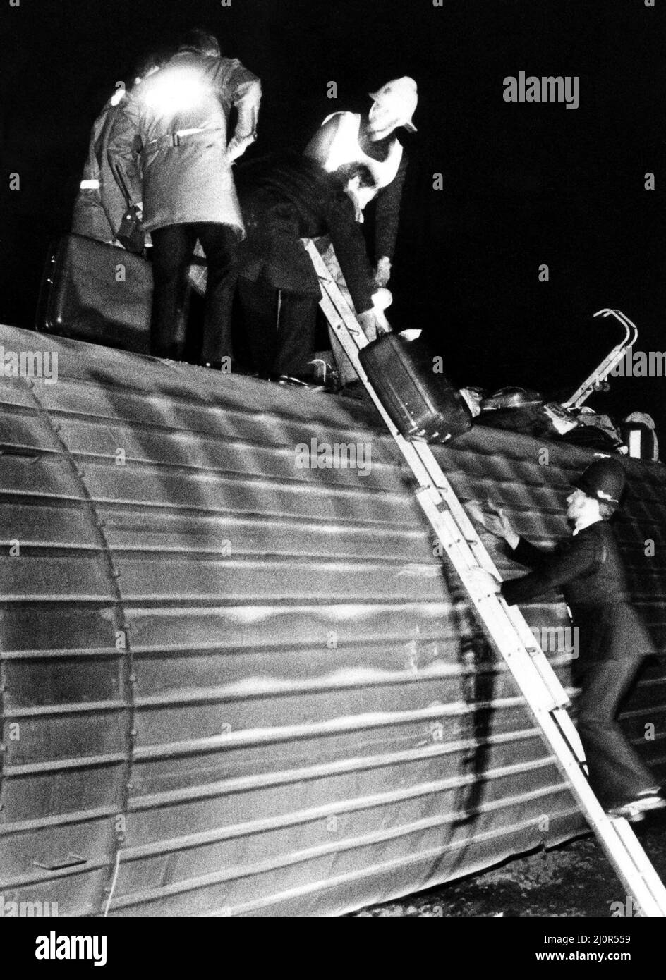 The crash of the Aberdeen to London sleeper train which careered off the track on the notorius Morpeth curve, just half a mile from the station. The crash happened at 10 minutes past midnight on 24th June, 1984   The scene at Morpeth as the emergency services check the overturned carriages Stock Photo