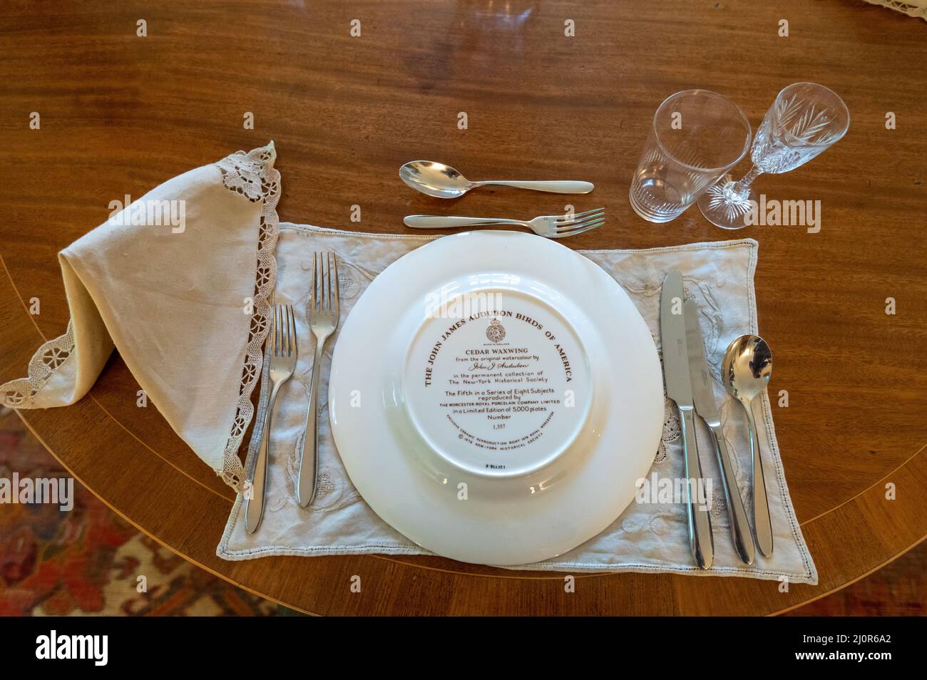 08-06-2021. Devon, UK. John James Audubon watercolor Birds of America on dining plates in Agatha Christie's summer Greenway House. Home of book writer Stock Photo