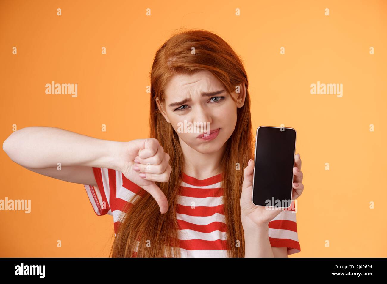 Very bad poor quality. Upset redhead female customer grimace