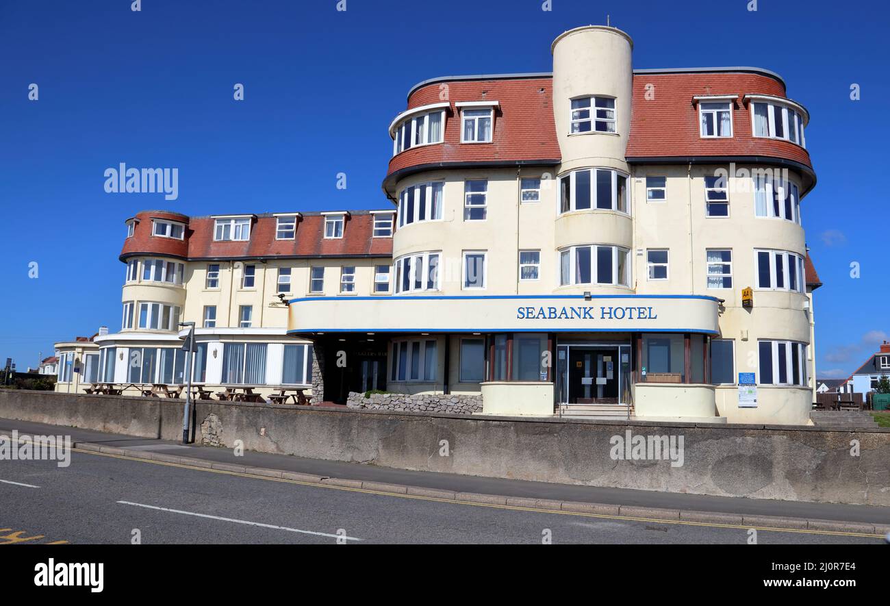 The Seabank Hotel situated right on the main road opposite the rocky shoreline of Porthcawl in South Wales. Stock Photo