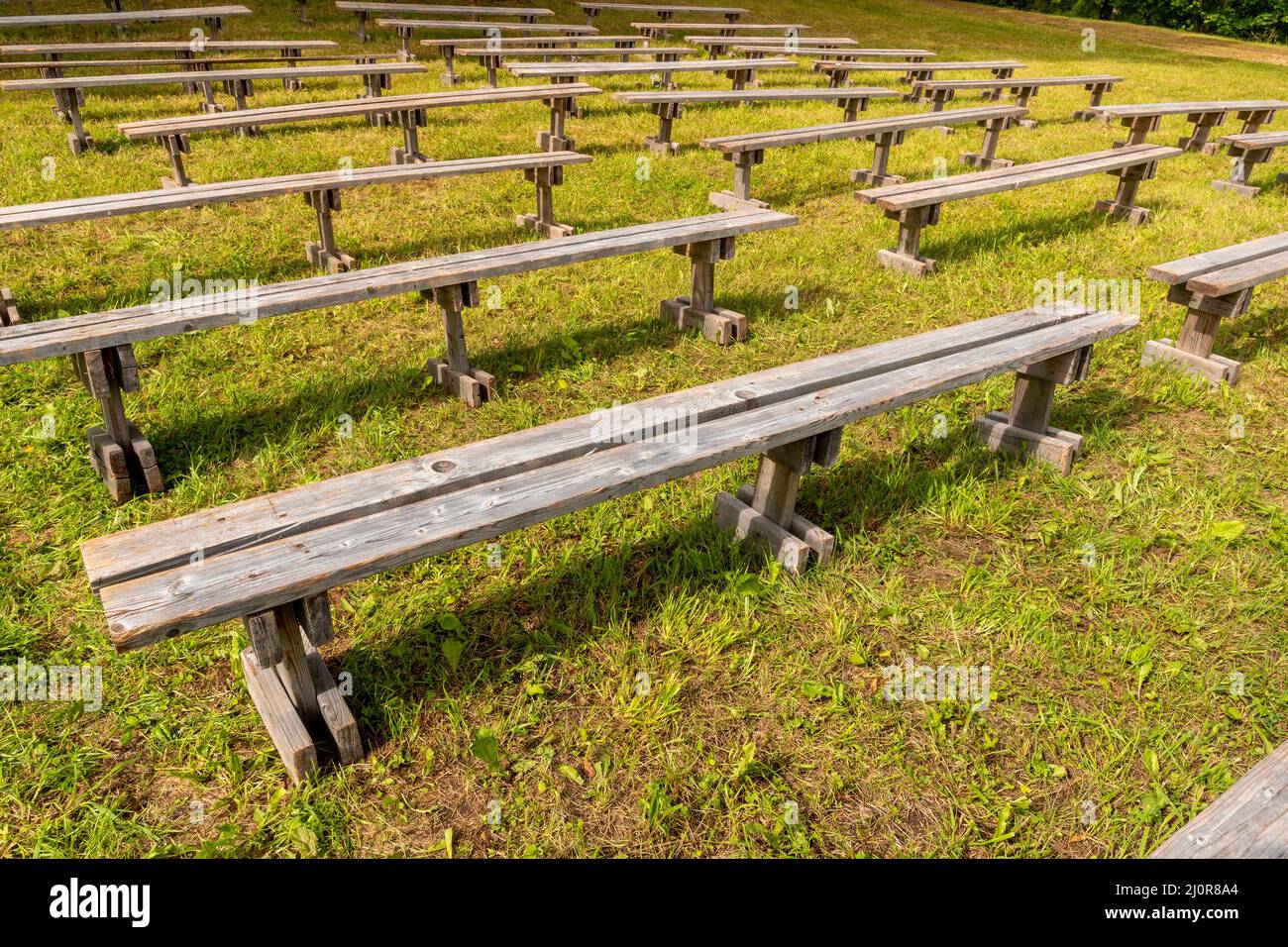 Empty wooden outdoor benches for spectators Stock Photo - Alamy