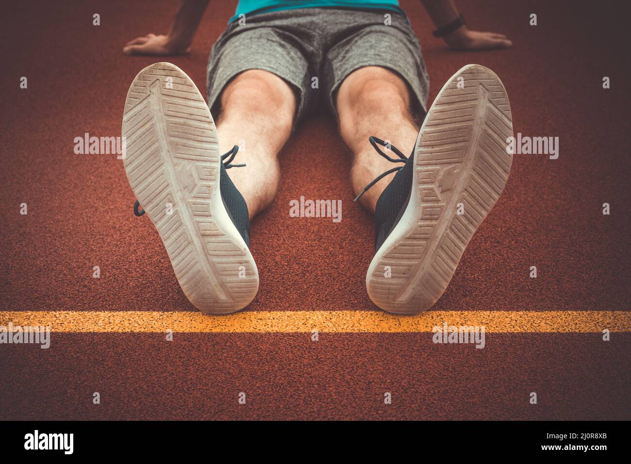 Man runner resting after workout session Stock Photo