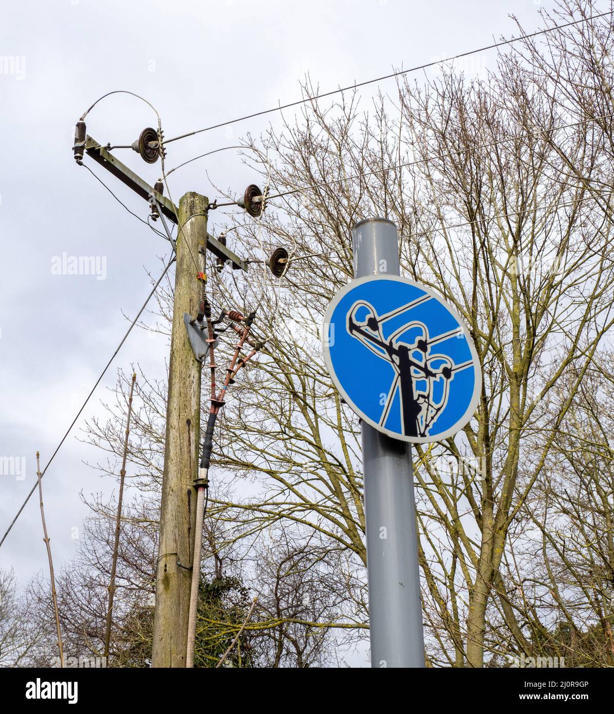 Literal hazard sign warning of overhead electricity cables - UK Stock Photo