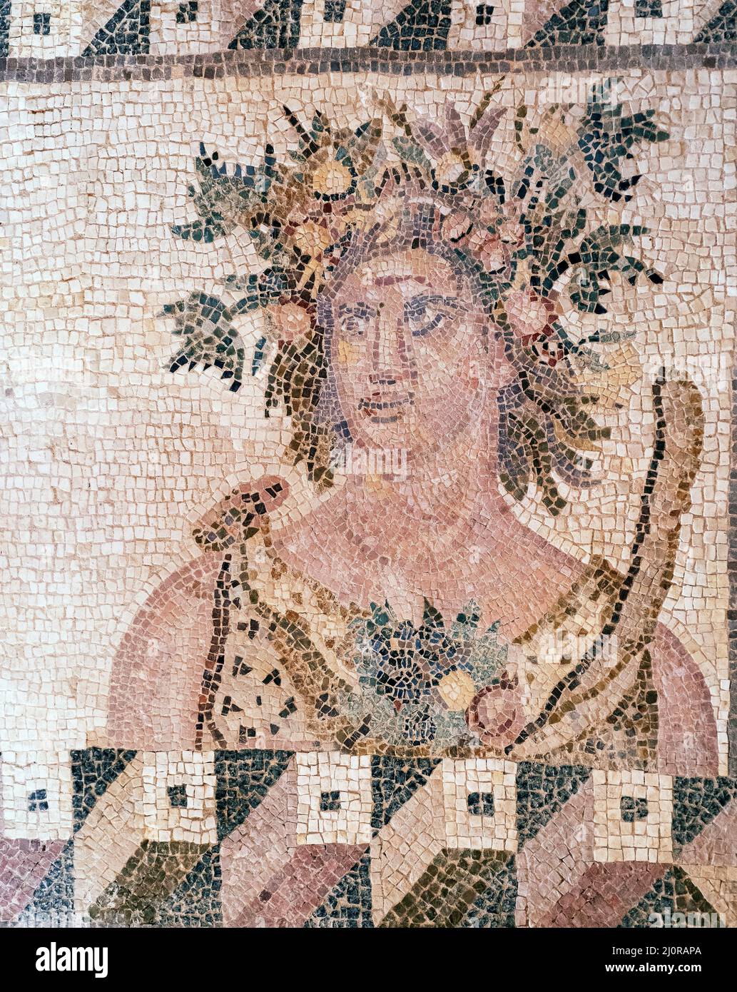 Panel from the Four Seasons mosaic depicting a bust of summer. House of Dionysus. The end of the 2nd century. Paphos Archaeological Park, Cyprus. Stock Photo