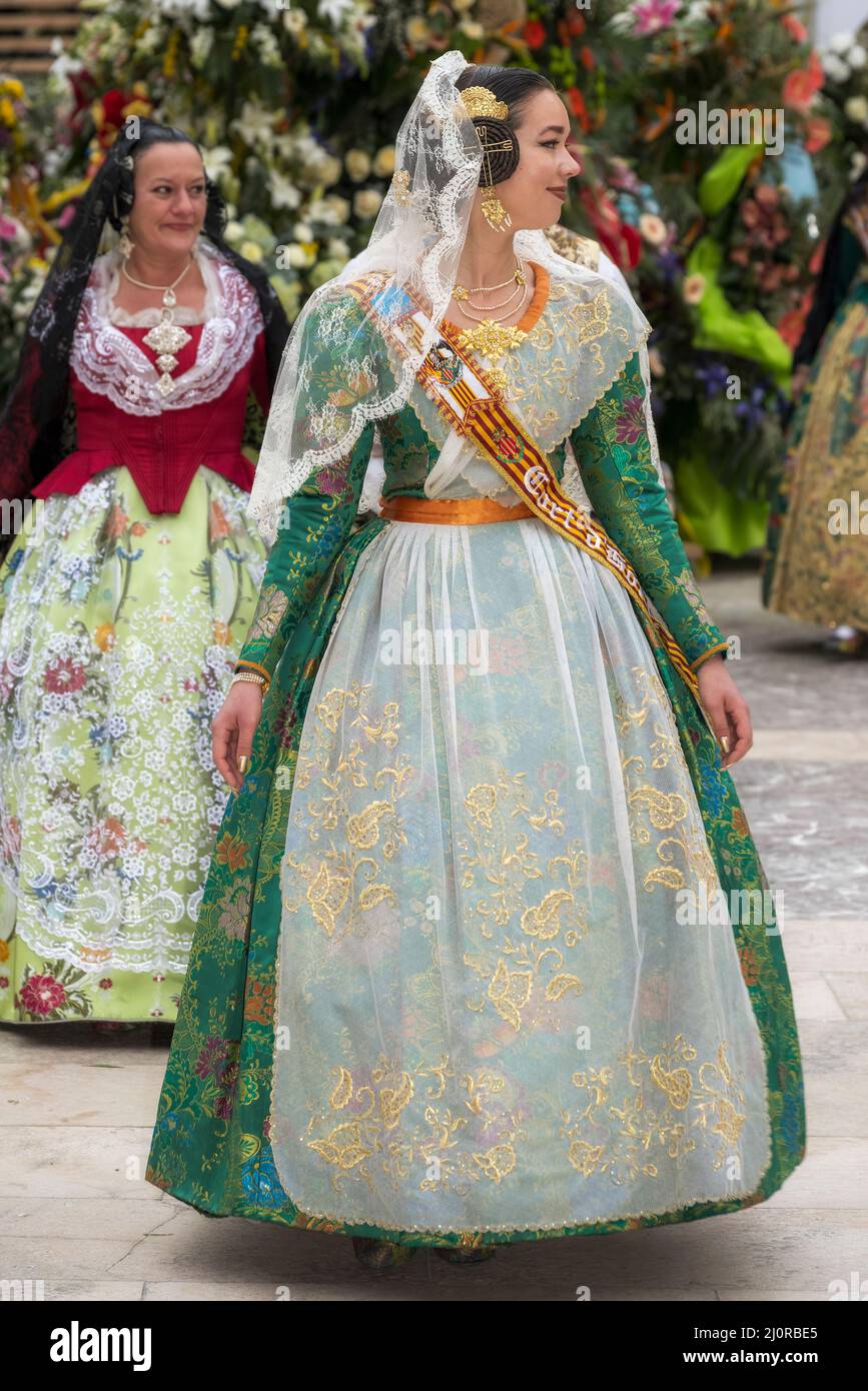 Woman fallera at the flower offering ceremony (ofrena de flors or ofrenda de flores) during the annual Fallas Festival, Valencia, Spain Stock Photo